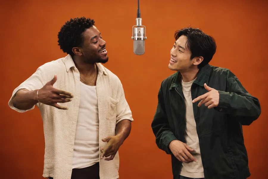 AI-generated friends performing together beneath a microphone in an orange studio